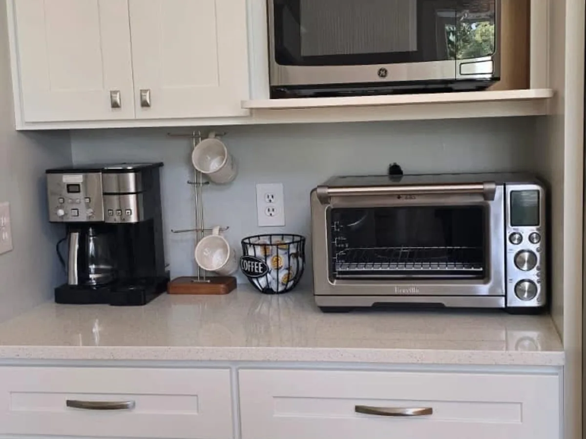 Quartz countertop with a wiped coffee maker and toaster oven